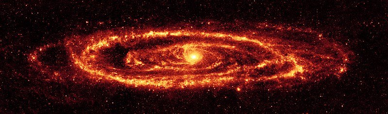 Cosmic dust of the Andromeda Galaxy as revealed in infrared light by the Spitzer Space Telescope. Source: <a href="https://en.wikipedia.org/wiki/File:Andromeda_galaxy_Ssc2005-20a1.jpg" target="_blank">Wikipedia</a>